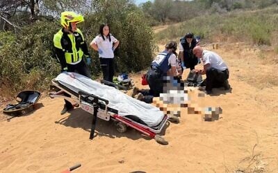 Magen David Adom medics attend to a 14-year-old boy who was injured apparently while playing with a gun, near Rishon Lezion, June 8, 2025. (MDA)