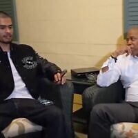 Antisemitic streamer Sneako (left) and New York City Mayor Eric Adams smoke cigars at Gracie Mansion. (Screenshot via JTA)