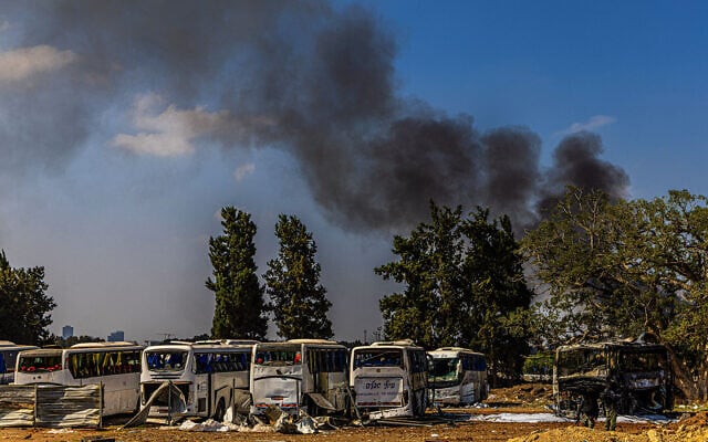 Firefighters work at a site hit by a missile launched from Iran in central Israel on June 17, 2025. (Eli Katzoff/Times of Israel)