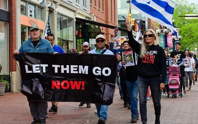 Rachel Amaru (right, with flag), founder of the Boulder chapter of Run For Their Lives, marches with other protesters in support of Israeli hostages held in Gaza in this undated photo (Courtesy/Run For Their Lives) Rachel Amaru (right, with flag), founder of the Boulder chapter of Run For Their Lives, marches with other protesters in support of Israeli hostages held in Gaza in this undated photo (Courtesy/Run For Their Lives)