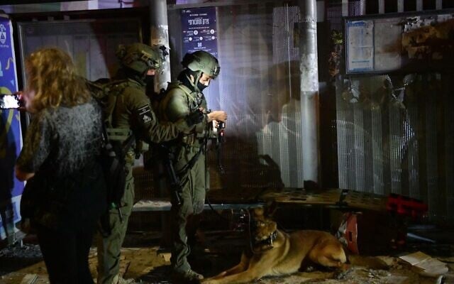 Soldiers of the Oketz canine unit operate at the site of a ballistic missile impact in Bat Yam, June 15, 2025. (Israel Defense Forces)