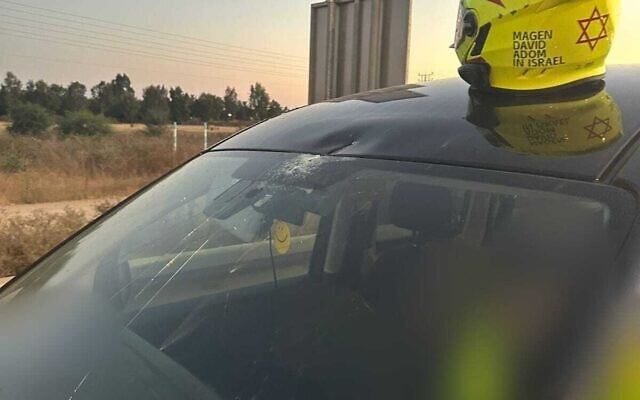 A car in which a person was lightly injured by a fragment of an Iranian missile on June 18, 2025 (Magen David Adom)