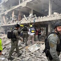 First responders at the site of a missile impact in central Israel on  June 22, 2025 (Magen David Adom)