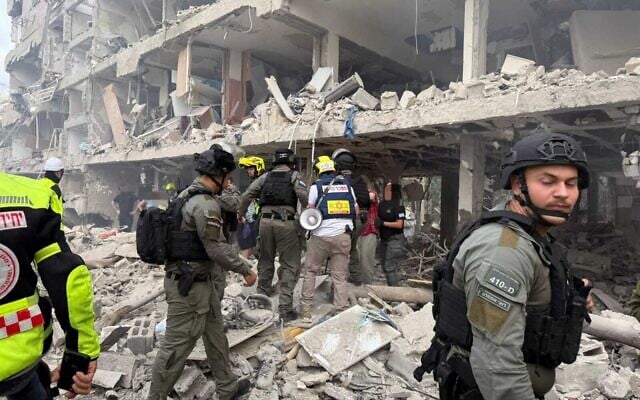 First responders at the site of a missile impact in central Israel on  June 22, 2025 (Magen David Adom)