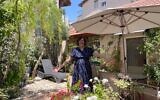 Jewish educator Yiscah Smith in her garden in Jerusalem on May 22, 2025. (Rossella Tercatin/Times of Israel)