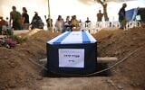 Slain hostage Ofra Keidar's coffin during her funeral at Kibbutz Be'eri cemetery, June 26, 2025. (Maya Mashal/Hostages and Missing Families Forum)