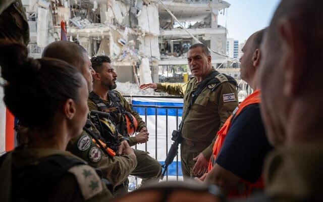 IDF Chief of Staff Lt. Gen. Eyal Zamir (center) speaks to officers at the scene of an Iranian ballistic missile impact in Bat Yam, June 17, 2025. (Israel Defense Forces) IDF Chief of Staff Lt. Gen. Eyal Zamir (center) speaks to officers at the scene of an Iranian ballistic missile impact in Bat Yam, June 17, 2025. (Israel Defense Forces)