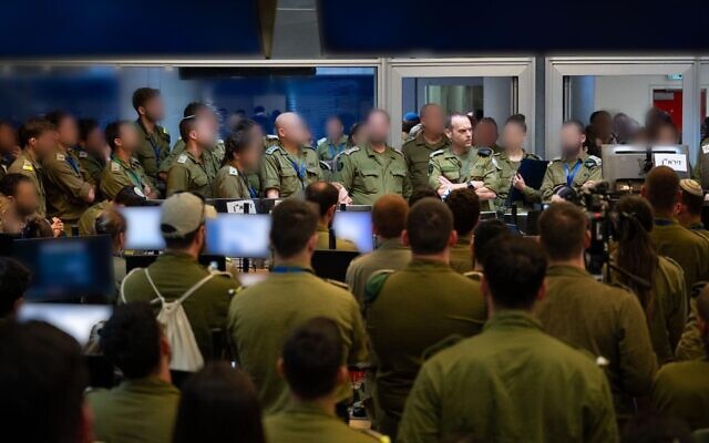 Military Intelligence Directorate chief Maj. Gen. Shlomi Binder (unblurred) speaks with soldiers at a command center, June 19, 2025. (Israel Defense Forces)