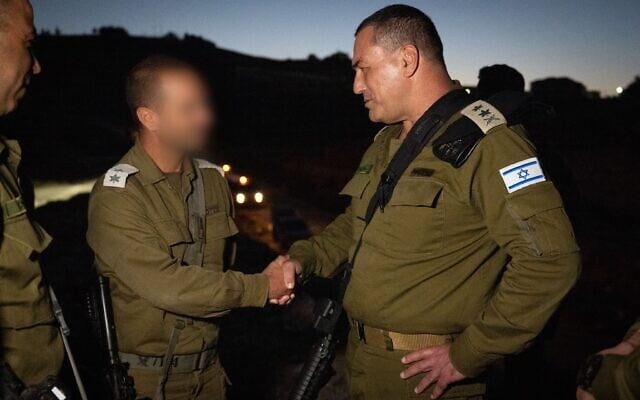 IDF Chief of Staff Lt. Gen. Eyal Zamir (left) shakes hands with the commander of the Binyamin Regional Brigade's 7114th Battalion, Lt. Col. "Gimmel" in the central West Bank, June 28, 2025. (Israel Defense Forces) IDF Chief of Staff Lt. Gen. Eyal Zamir (left) shakes hands with the commander of the Binyamin Regional Brigade's 7114th Battalion, Lt. Col. "Gimmel" in the central West Bank, June 28, 2025. (Israel Defense Forces)