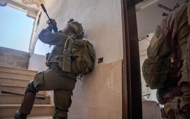IDF troops operate in the Jabalia area of north Gaza, in a handout photo published June 29, 2025. (Israel Defense Forces)