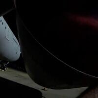 A member of Palestine Action sprays red paint on a plane at RAF Brize Norton on June 20, 2025 (Screen grab)