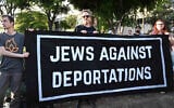 Three individuals hold a sign reading 'Jews Against Deportations' during an interfaith vigil in Los Angeles on June 10, 2025. (Keith Birmingham/MediaNews Group/Pasadena Star-News via Getty Images via JTA)