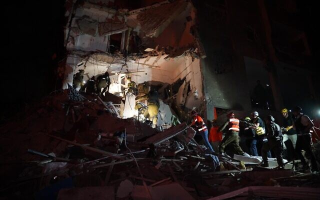 Search and rescue teams at the scene of an Iranian missile strike on June 15, 2025 in Rehovot (Israel Defense Force) Search and rescue teams at the scene of an Iranian missile strike on June 15, 2025 in Rehovot (Israel Defense Force)