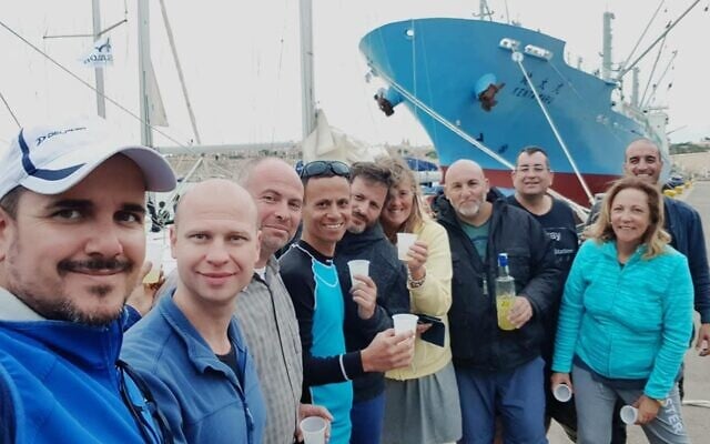 Passengers stranded in Larnaca readying to board a sailing boat chartered by Israel's Sailor Yacht Club to return home to the Herzliya harbor, June 2025. (Courtesy)