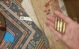 Four bullet casings that relatives say they found in Jassem al-Sadeh’s room after his death on May 28, 2025, along with traces of blood on the bed where they say he was sleeping. (Courtesy)