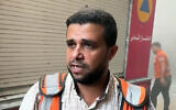 Gaza Civil Defense spokesperson Mahmoud Basal, who the IDF says is part of Hamas's military wing, speaks to reporters at the site of a strike on the Safad School in the Zeitoun neighborhood of Gaza City, September 1, 2024. (STRINGER/AFPTV/AFP)