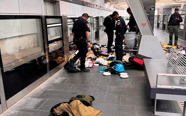 Police sort through the luggage of two West Bank Palestinians who were reported to be carrying a suspicious object, in south Tel Aviv's Elifelet light rail station, June 4, 2025. (Israel Police)