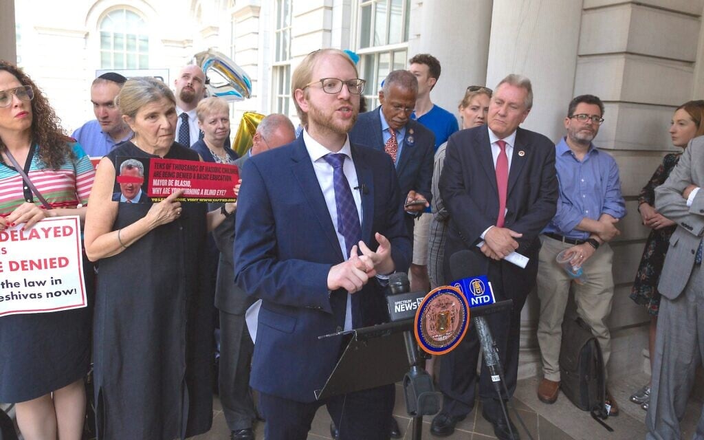 Naftuli Moster, then-executive director of the nonprofit advocacy group Yaffed, speaks at a news conference, July 24, 2019. (Yaffed via JTA)