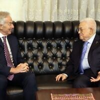 This handout picture released by the Palestinian Authority's press office (PPO) shows President Mahmoud Abbas (R) meeting with Britain's former prime minister Tony Blair in Amman, Jordan, on July 13, 2025. (Photo by Thaer GHANAIM / PPO / AFP)