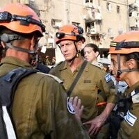Home Front Command chief Maj. Gen. Rafi Milo (center) at the scene of an Iranian ballistic missile impact in central Israel, June 16, 2025. (Israel Defense Forces)