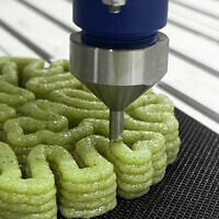 A 3D printer produces an innovative building material designed at the Technion-Israel Institute of Technology in Haifa in which microorganisms bind sand together. The final product is being exhibited in one of nine international installations at the Triennale, Milan. (Disrupt.Design Lab, Faculty of Architecture and Town Planning, the Technion)
