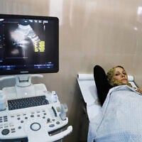 Fatima Arfa, a pregnant and displaced Palestinian woman, undergoes a medical check-up at Al-Helou hospital, in Gaza City, in the northern Gaza Strip, July 10, 2025. (REUTERS/Ebrahim Hajjaj)