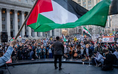 The head of the People's Forum, Manolo de los Santos, addresses a crowd in New York City, March 10, 2025. (Luke Tress/Times of Israel) The head of the People's Forum, Manolo de los Santos, addresses a crowd in New York City, March 10, 2025. (Luke Tress/Times of Israel)
