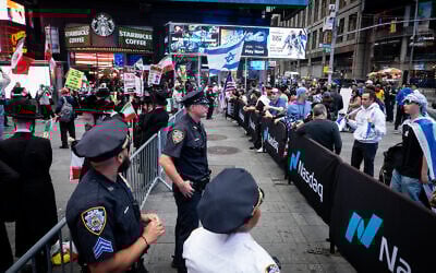 Police separate pro- and anti-Israel protesters in New York City, June 16, 2025. (Luke Tress/Times of Israel)