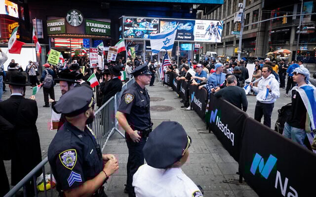 Police separate pro- and anti-Israel protesters in New York City, June 16, 2025. (Luke Tress/Times of Israel)