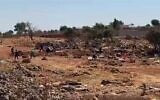 Settlers hurl stones, reportedly during clashes with Palestinians, in the West Bank town of Sinjil on July 11, 2025. (Screen capture: Al-Jarmaq News)