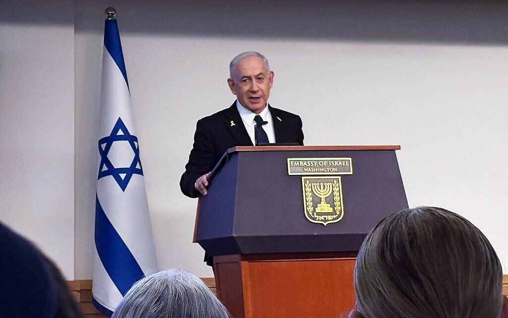 Prime Minister Benjamin Netanyahu speaks at a memorial service for slain embassy employees Yaron Lischinsky and Sarah Milgrim at the Israeli embassy in Washington, DC, July 10, 2025. (Lazar Berman/Times of Israel)