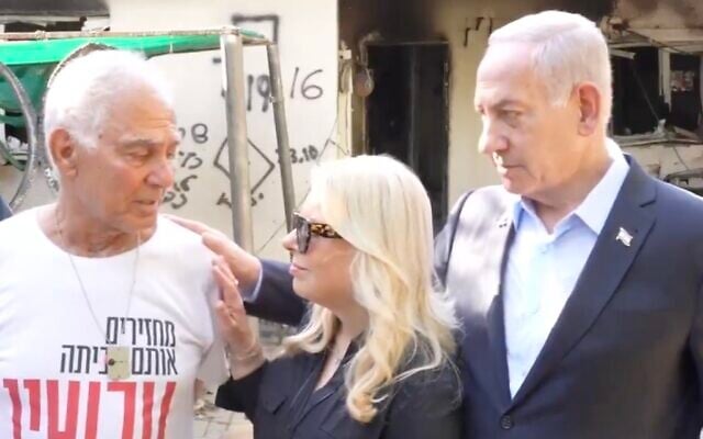 Prime Minister Benjamin Netanyahu and his wife Sara with freed hostage Gadi Mozes, at Kibbutz Nir Oz on July 3, 2025. (X screenshot) Prime Minister Benjamin Netanyahu and his wife Sara with freed hostage Gadi Mozes, at Kibbutz Nir Oz on July 3, 2025. (X screenshot)