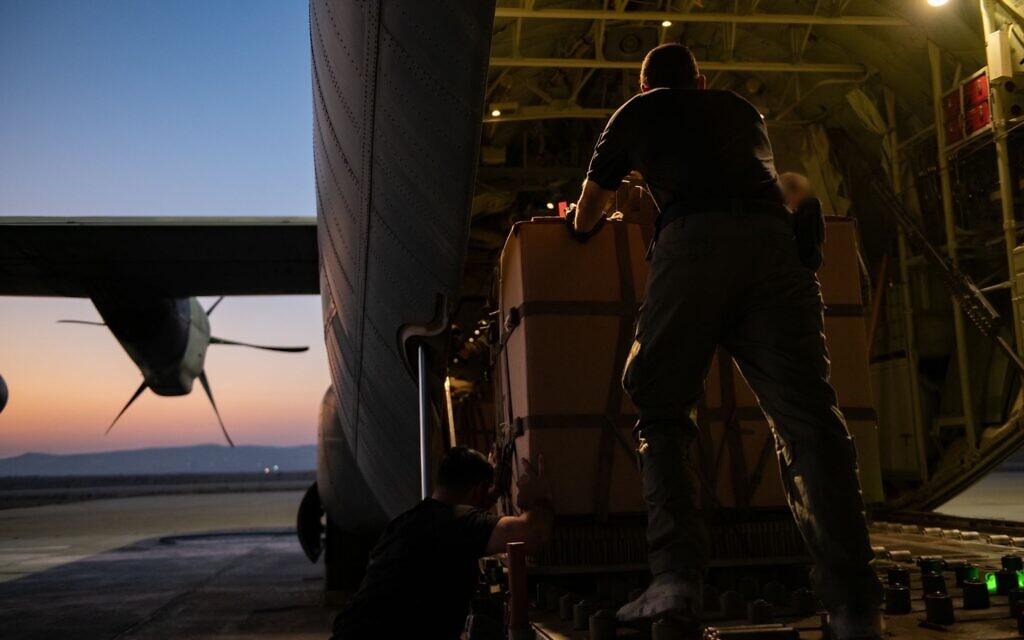 Humanitarian aid is prepared on an Israeli Air Force cargo plane for an airdrop in the Gaza Strip, in a handout photo issued on July 26, 2025. (Israel Defense Forces)