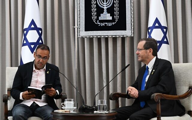 President Isaac Herzog (right) meets with former hostage Eli Sharabi at the President's Residence, July 10, 2025. (Haim Zach/GPO)