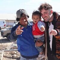Awdah Hathaleen (left) with Mattan Berner Kadish (right) and Hathaleen's son (center) in Umm al-Khair. (Courtesy)