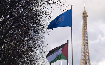 A Palestinian and UN flag wave together for the first time above a UN agency, the UNESCO headquarters in Paris (with the Eiffel tower in the background), on December 13, 2011. (Photo by Joël SAGET / AFP) A Palestinian and UN flag wave together for the first time above a UN agency, the UNESCO headquarters in Paris (with the Eiffel tower in the background), on December 13, 2011. (Photo by Joël SAGET / AFP)