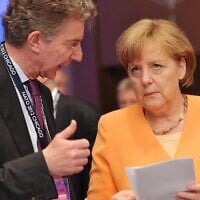 German Chancellor Angela Merkel (R) chats with her foreign policy adviser Christoph Heusgen before the opening session of the North Atlantic Council during the NATO Summit on May 20, 2012, at McCormick Place in Chicago. (Mandel Ngan/AFP)