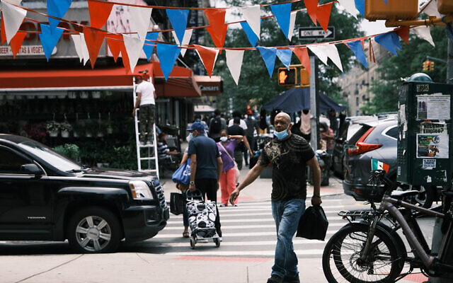 Illustrative: People walk through the Washington Heights neighborhood in Manhattan on June 11, 2021 in New York City. (Spencer Platt/ Getty Images/ AFP/ File) Illustrative: People walk through the Washington Heights neighborhood in Manhattan on June 11, 2021 in New York City. (Spencer Platt/ Getty Images/ AFP/ File)