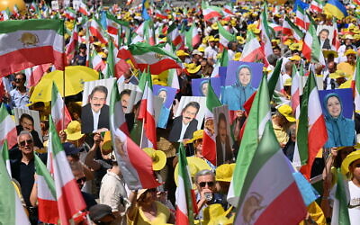 Protesters hold pictures of Maryam Rajavi and Massoud Rajavi, leaders of the People's Mujahedin of Iran (MEK), during a demonstration in Berlin, on June 29, 2024 (RALF HIRSCHBERGER / AFP) Protesters hold pictures of Maryam Rajavi and Massoud Rajavi, leaders of the People's Mujahedin of Iran (MEK), during a demonstration in Berlin, on June 29, 2024 (RALF HIRSCHBERGER / AFP)