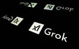 This photograph shows screens displaying the logo of Grok, a generative artificial intelligence chatbot developed by US artificial intelligence company xAI, in Toulouse, southern France, on January 15, 2025. (Lionel Bonaventure / AFP)