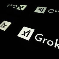 This photograph shows screens displaying the logo of Grok, a generative artificial intelligence chatbot developed by US artificial intelligence company xAI, in Toulouse, southern France, on January 15, 2025. (Lionel Bonaventure / AFP)