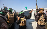 Illustrative: Palestinian terrorist groups Islamic Jihad and Hamas arrive near the family home of slain Hamas leader Yahya Sinwar before handing over Israeli hostages and a Thai hostage to a Red Cross team in Khan Yunis on January 30, 2025. (Eyad Baba/AFP)