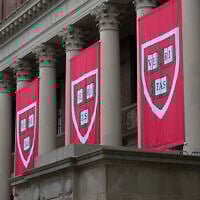 Harvard banners hang in front of Widener Library during the 374th Harvard Commencement in Harvard Yard in Cambridge, Massachusetts, on May 29, 2025. (Rick Friedman / AFP)