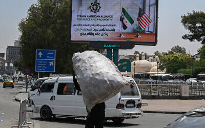 An advertisement billboard thanking US President Donald Trump is set up on a major roadway in Damascus on June 11, 2025. (LOUAI BESHARA / AFP)