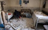 A man checks the debris at a room of Evin Prison's hospital, after Israeli air strikes the previous month, in Tehran, Iran, on July 1, 2025. (AFP)