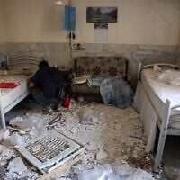 A man checks the debris at a room of Evin Prison's hospital, after Israeli air strikes the previous month, in Tehran, Iran, on July 1, 2025. (AFP)