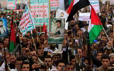 Yemenis carry a portrait of Houthi leader Abdul Malik al-Houthi during a rally in the Houthi-run capital Sanaa, Yemen, on July 4, 2025. (Mohammed HUWAIS / AFP)