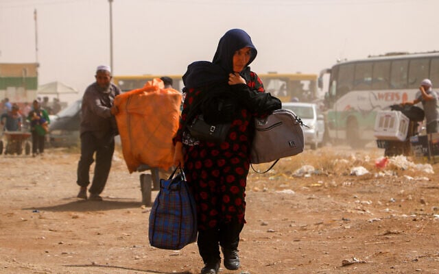 Afghan refugees arrive from Iran at Islam Qala border between Afghanistan and Iran, on July 5, 2025 (Mohsen KARIMI / AFP) Afghan refugees arrive from Iran at Islam Qala border between Afghanistan and Iran, on July 5, 2025 (Mohsen KARIMI / AFP)