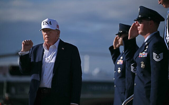 US President Donald Trump pumps his fist as he arrives at Joint Base Andrews in Maryland, on July 6, 2025, after spending the weekend at his residence in Bedminster, New Jersey. (Brendan SMIALOWSKI / AFP) US President Donald Trump pumps his fist as he arrives at Joint Base Andrews in Maryland, on July 6, 2025, after spending the weekend at his residence in Bedminster, New Jersey. (Brendan SMIALOWSKI / AFP)