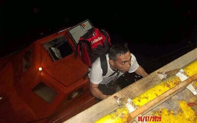 This handout picture provided by the UAE Ministry of Foreign Affairs reportedly shows members of the Greek-owned, Liberian-flagged Magic Seas commercial vessel climbing on board the Safeen Prism, after being rescued following a Houthi attack that forced them to abandon ship, in the Red Sea on July 6, 2025. (UAE's Ministry of Foreign Affairs and International Cooperation / AFP)